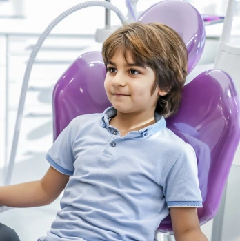 A kid waiting for paediatric dental appointment at Rekhas dental care